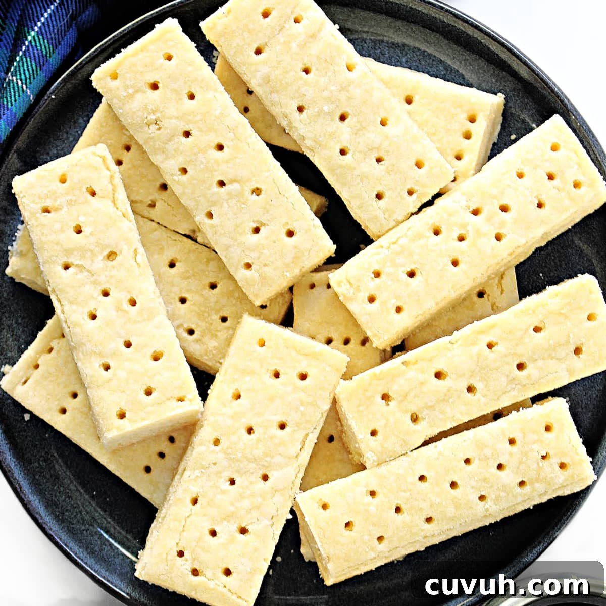 Closeup of tops of shortbread fingers with docking holes.