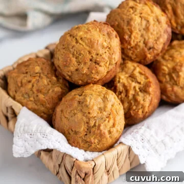 A small basket filled with muffins.