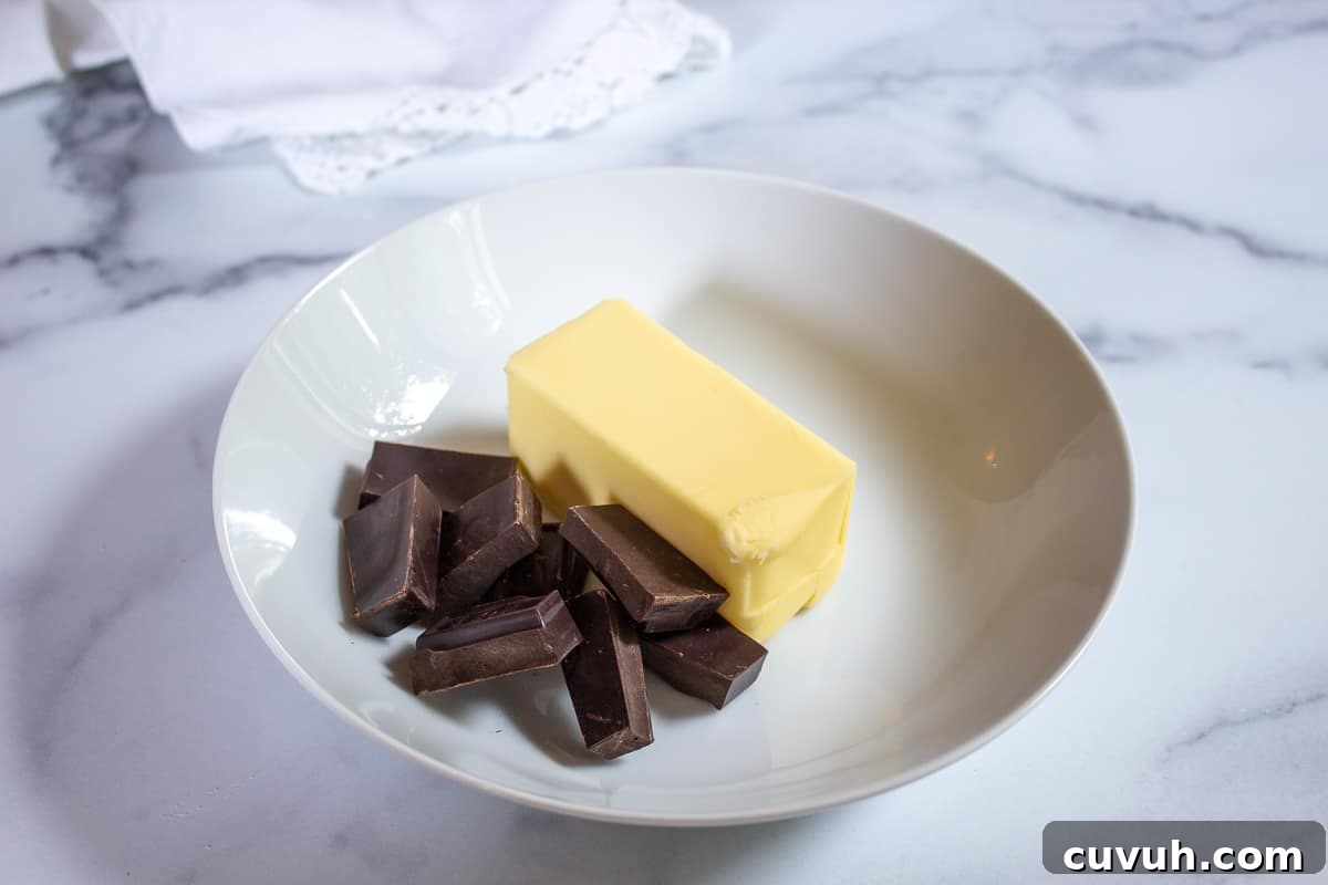 Chunks of chocolate and a stick of butter.
