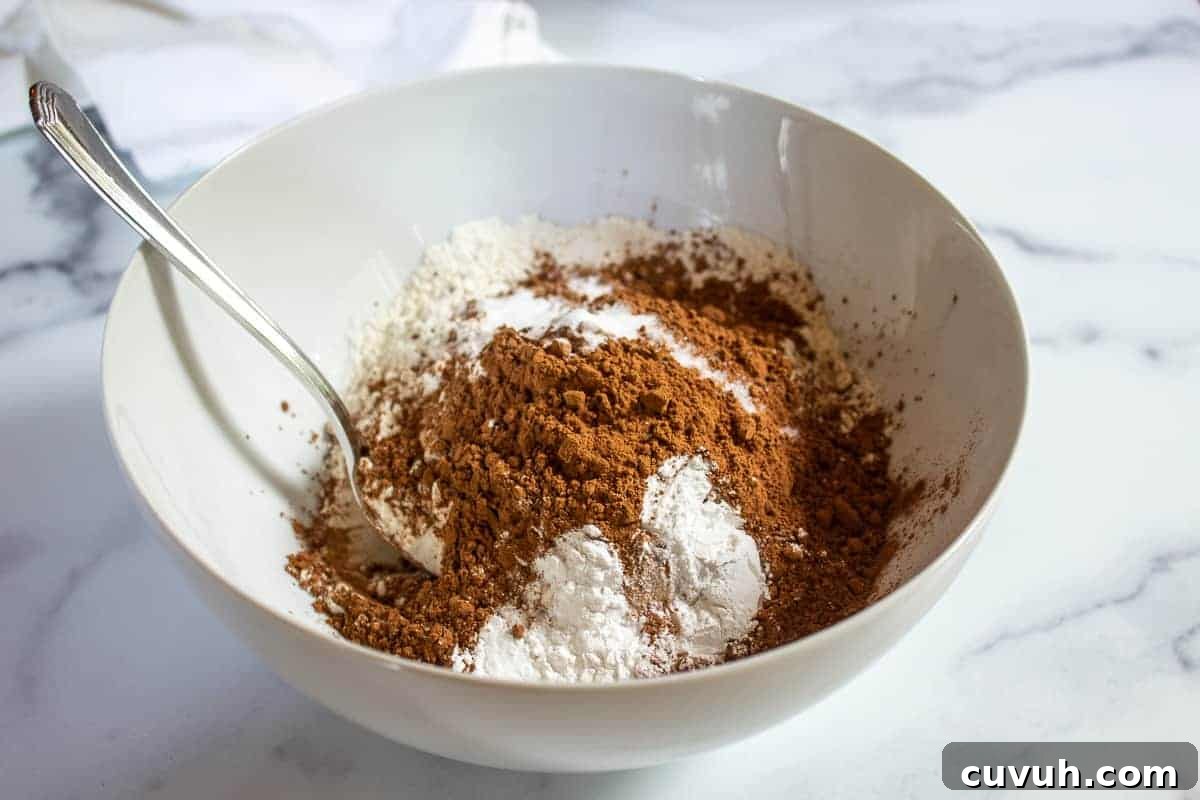Flour and cocoa powder in a white bowl.