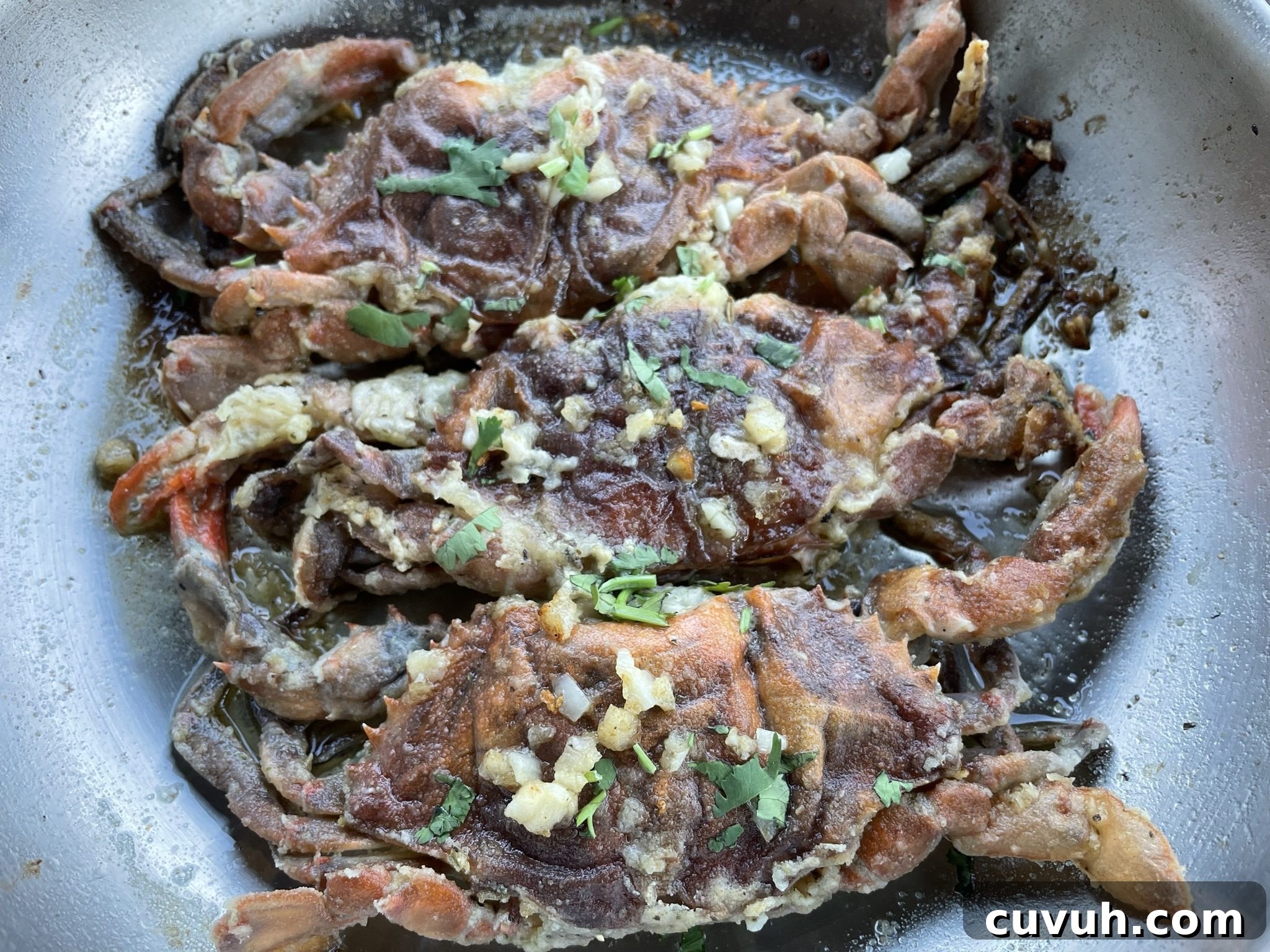 Pan-Seared Soft-Shell Crab with Garlic Butter and Fresh Herbs 7 Cooked crab, orange in color