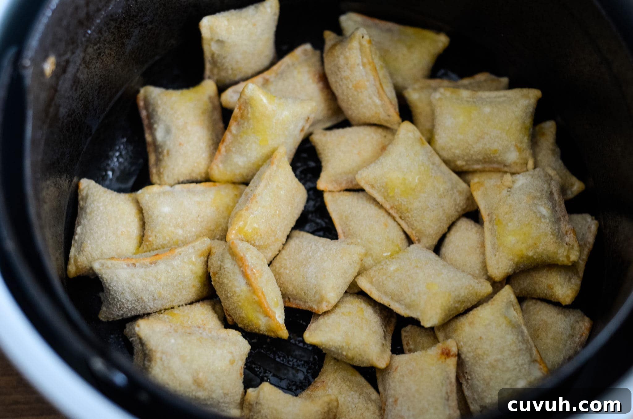 Crispy Air Fryer Pizza Rolls Ready in 8 Minutes 3 air fryer pizza rolls in air fryer basket
