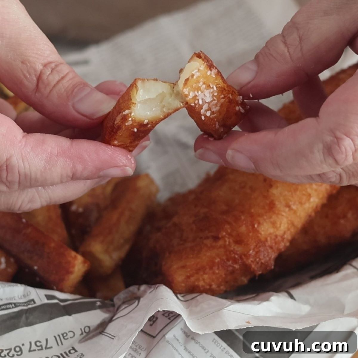 breaking open a French fry.