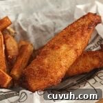 fish and chips in basket lined with newspaper.