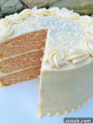 Applesauce Spice Cake, sliced, on a cake pedestal.