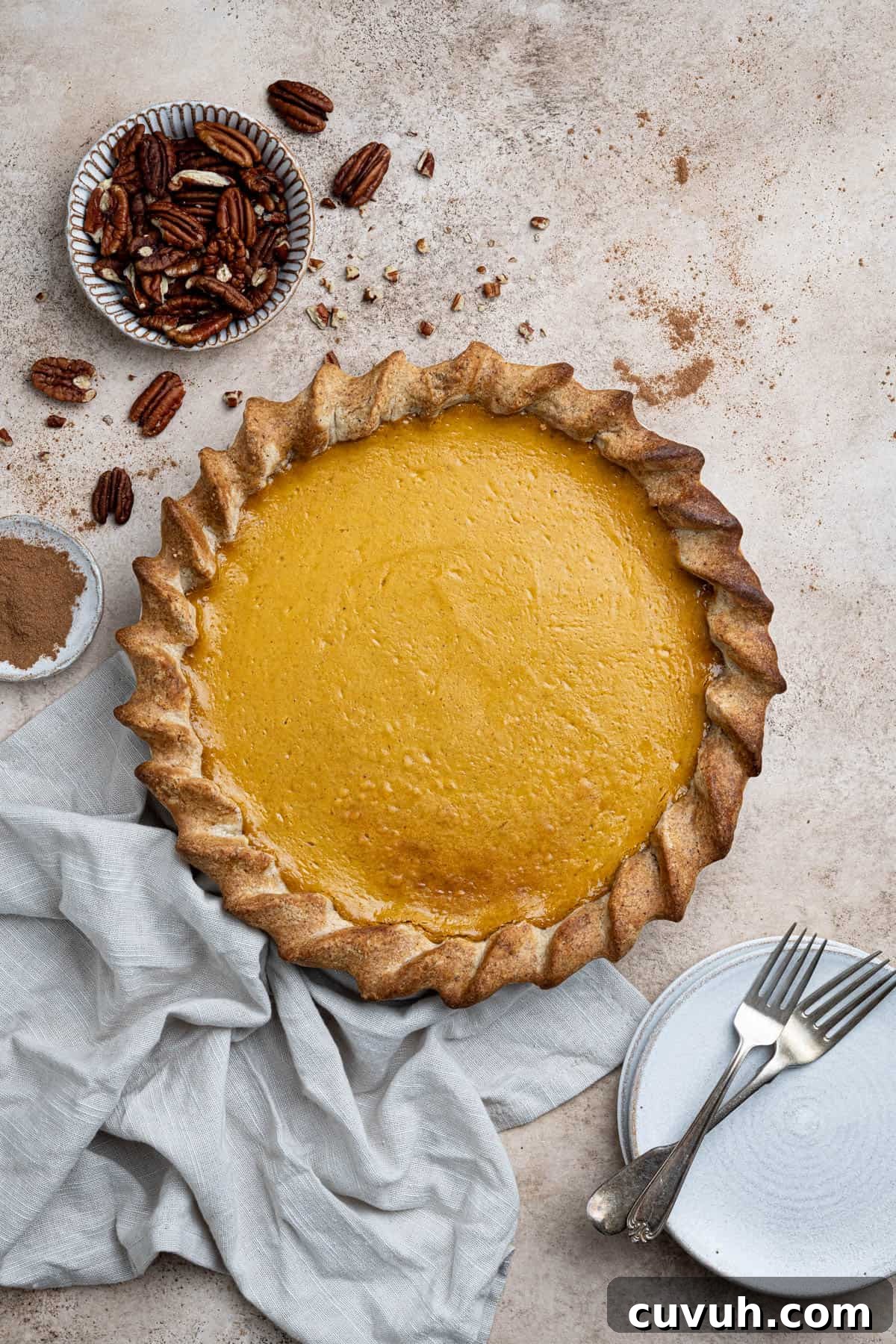 The sliced vegan sweet potato pie in a white pie dish.