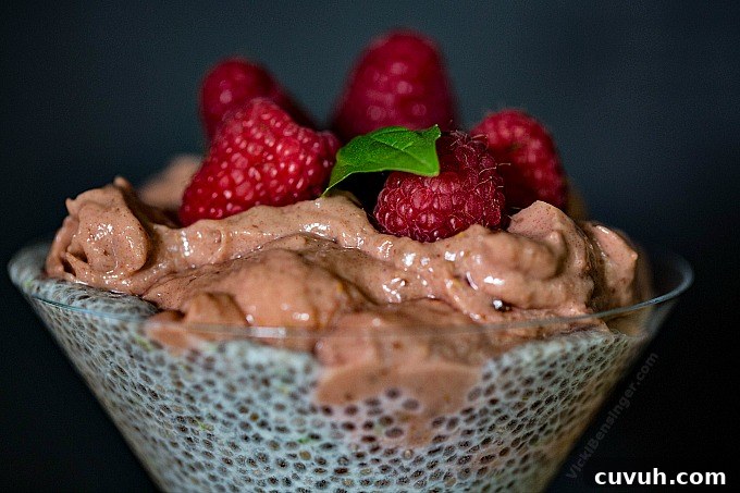 Raspberry Mousse and Chia Parfait Recipe for Light Desserts 4 Raspberry Mousse & Chia Parfait topped with fresh Raspberries and sprig of basil