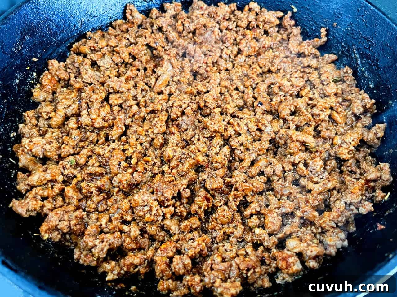 Copycat Taco Bell Mexican Pizza Recipe to Make at Home 5 ground beef taco meat in a pan.