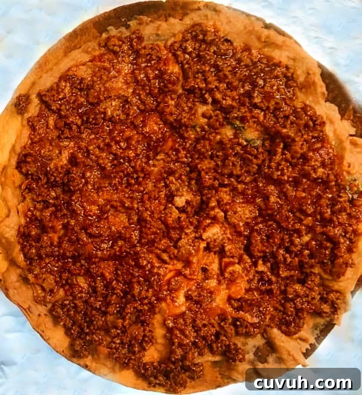 Copycat Taco Bell Mexican Pizza Recipe to Make at Home 7 flour tortilla with beans and ground beef.