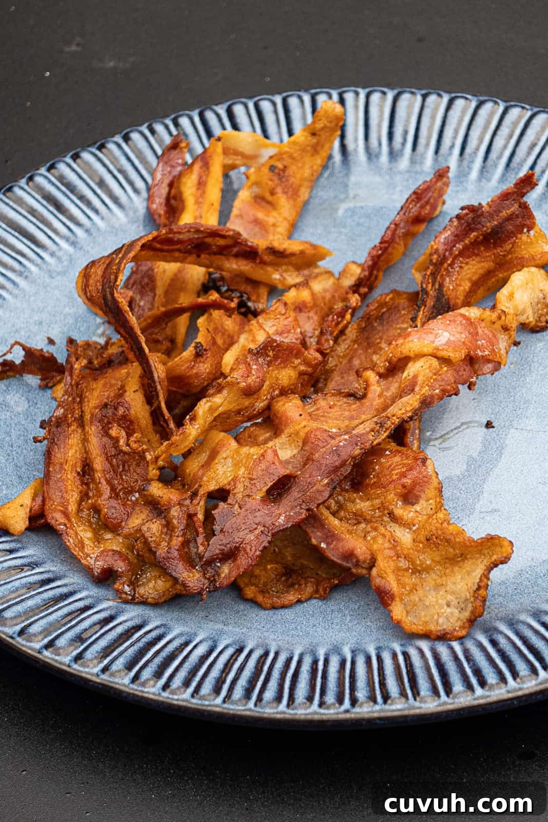 Crispy Bacon on the Blackstone Griddle: Tips for Perfect Results 3 Crispy Blackstone Bacon On A Breakfast Plate