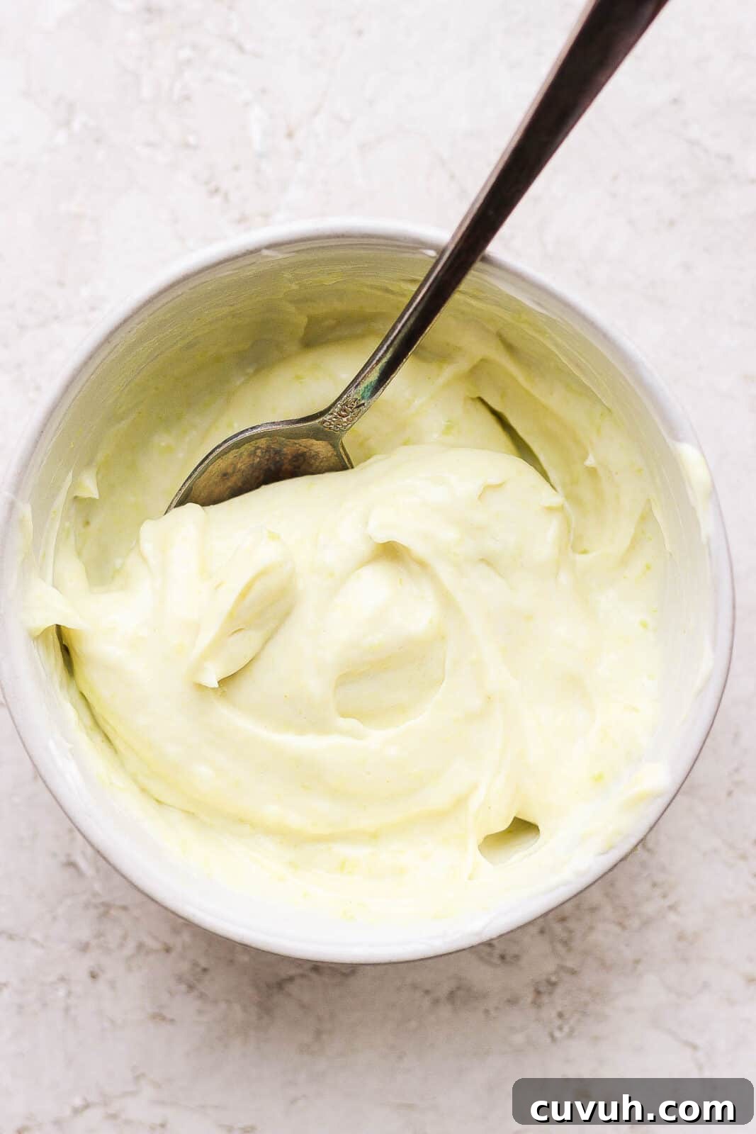 Creamy Wasabi Mayo Recipe for Sandwiches, Sushi & Dips 6 Wasabi mayo in a bowl with a spoon.