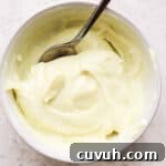 Creamy Wasabi Mayo Recipe for Sandwiches, Sushi & Dips 8 Bowl of wasabi mayo with a spoon in it.