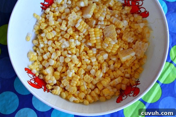Fresh Corn fresh corn in a white bowl with lobster print, set on a blue and green polka dot tablecloth
