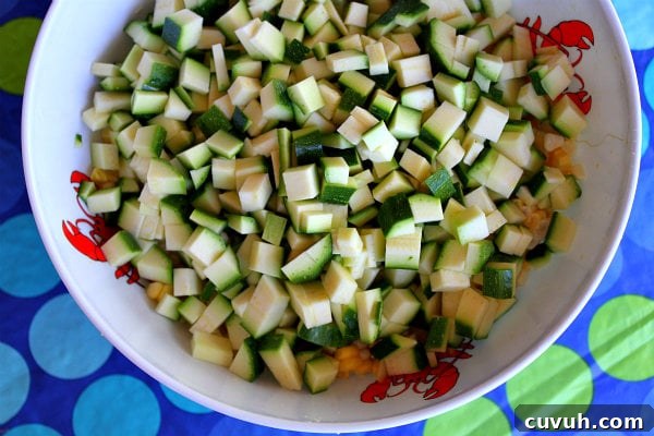 Zucchini zucchini in a white bowl set on a blue and green polka dot tablecloth