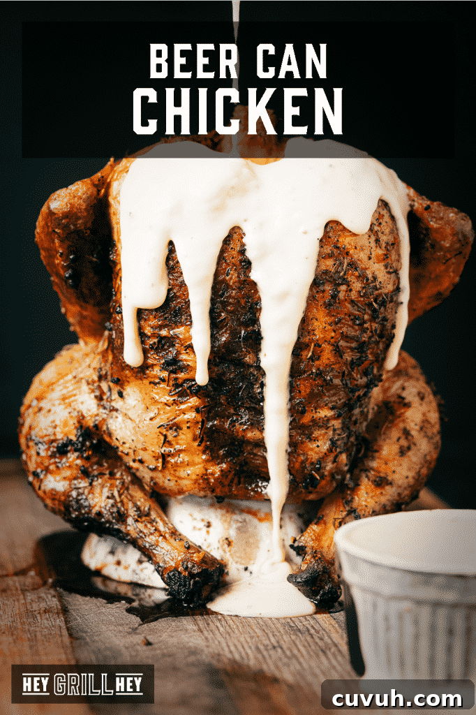 Crispy Grilled Beer-Can Chicken Recipe for Juicy Poultry 2 Beer can chicken covered in beer cheese with text overlay - Beer Can Chicken.