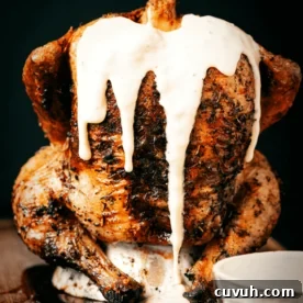 Crispy Grilled Beer-Can Chicken Recipe for Juicy Poultry 8 Beer can chicken covered in beer cheese.