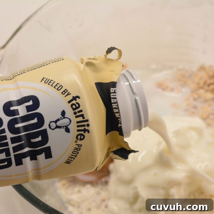 Pour milk into the oat mixture and stir to combine.