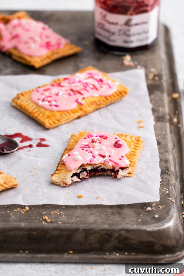 Crispy Air Fryer Pop-Tarts: Quick Homemade Toaster Pastry Recipe 11 Air Fryer Pop Tart with a bite taken out of it.