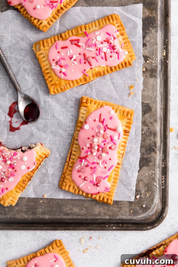 Crispy Air Fryer Pop-Tarts: Quick Homemade Toaster Pastry Recipe 12 Air Fryer Pop Tarts on a sheet pan.