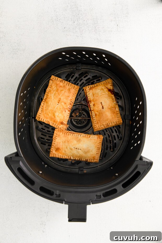 Crispy Air Fryer Pop-Tarts: Quick Homemade Toaster Pastry Recipe 8 Cooked pop tarts in the air fryer.