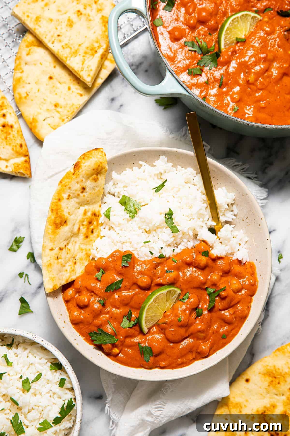 Chickpea Tikka Masala Recipe: Flavorful Vegan Curry in 30 Minutes 9 Plate of chickpea curry with rice and naan.