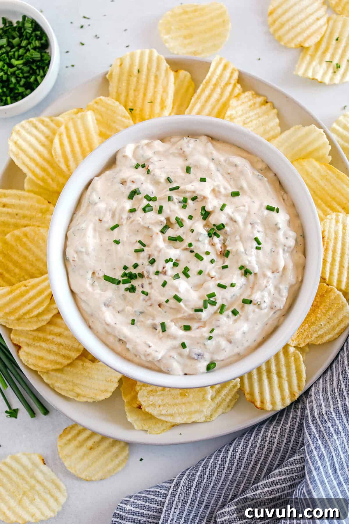 Delicious High Protein French Onion Dip made healthier with protein-packed cottage cheese, caramelized onions, and fresh herbs for the perfect dip to serve with chips, veggies and crackers!