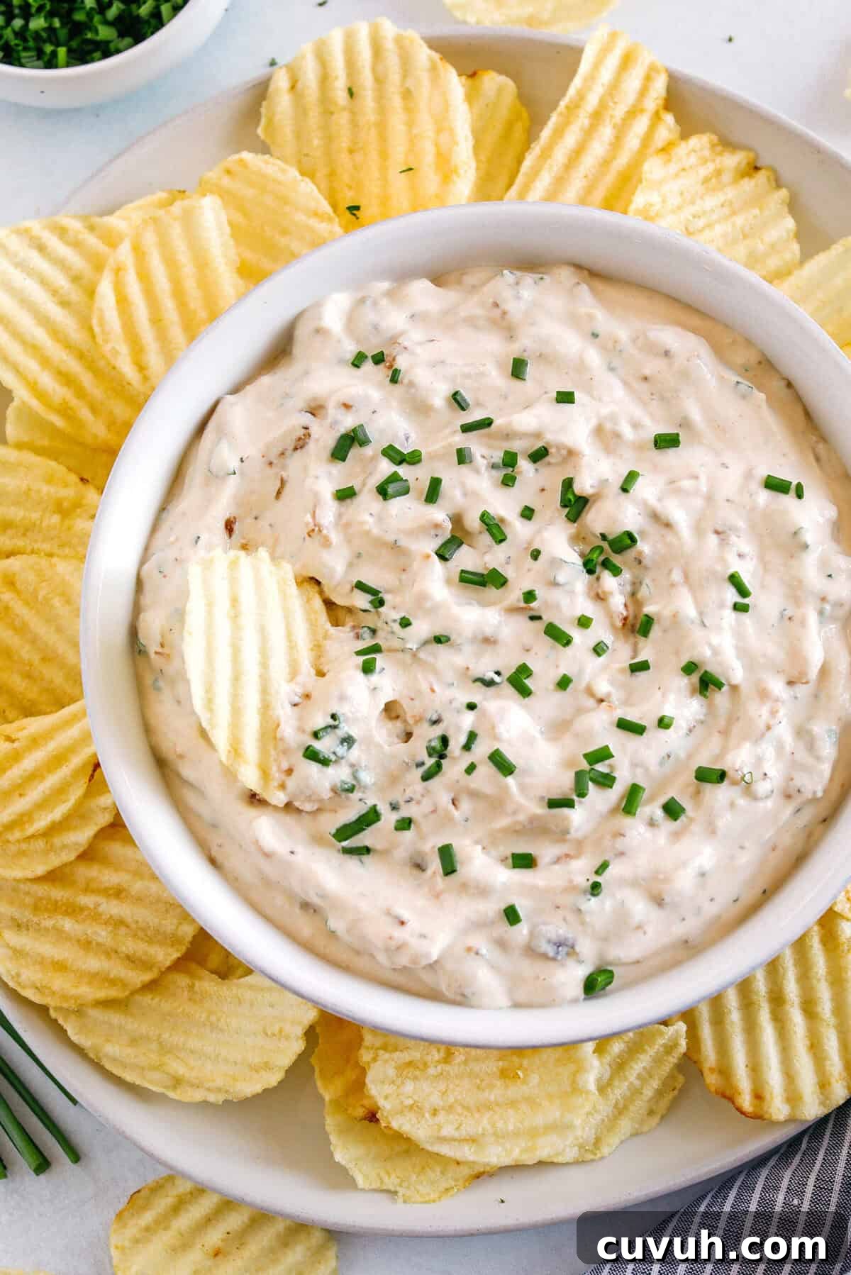 Delicious High Protein French Onion Dip made healthier with protein-packed cottage cheese, caramelized onions, and fresh herbs for the perfect dip to serve with chips, veggies and crackers!