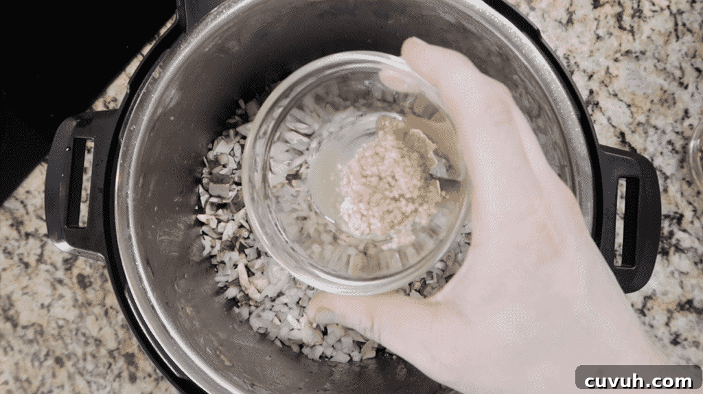 Adding garlic to pot
