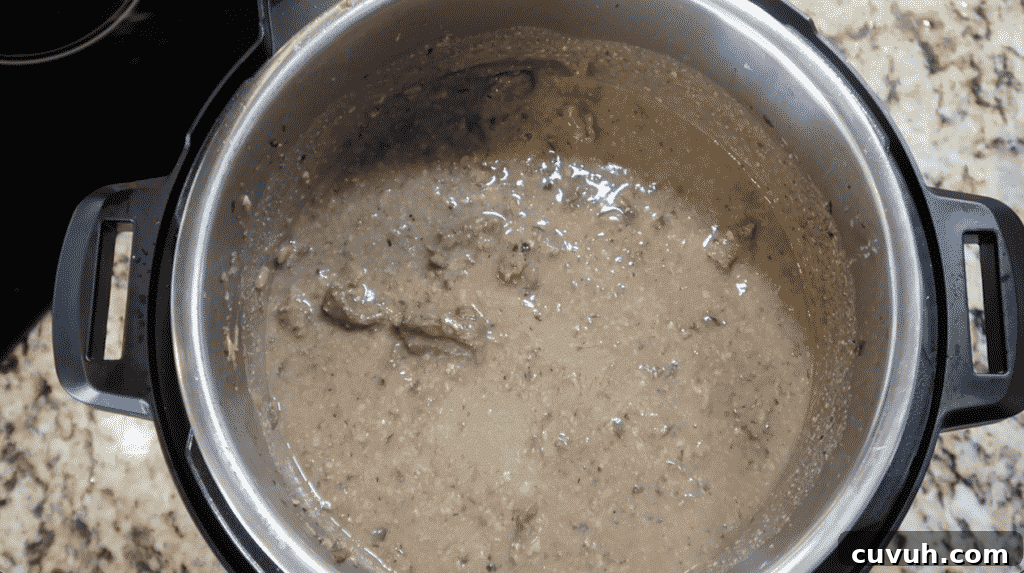 Finishing Beef Wellington pie filling.