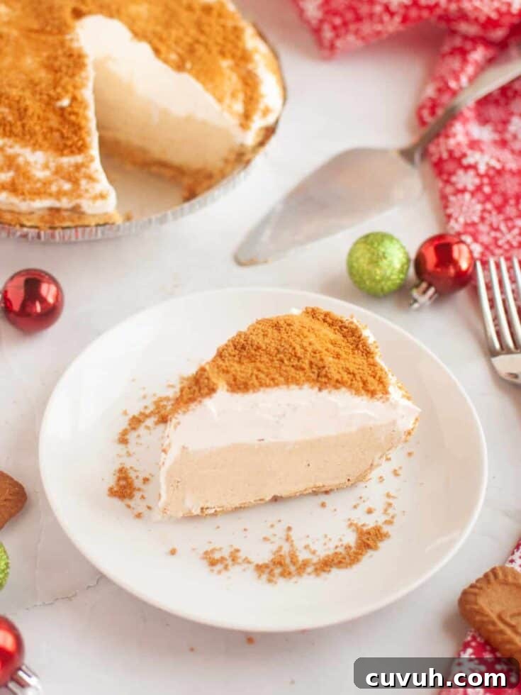slice of no bake gingerbread cream pie served on a white plate, with the rest of the pie in the background.