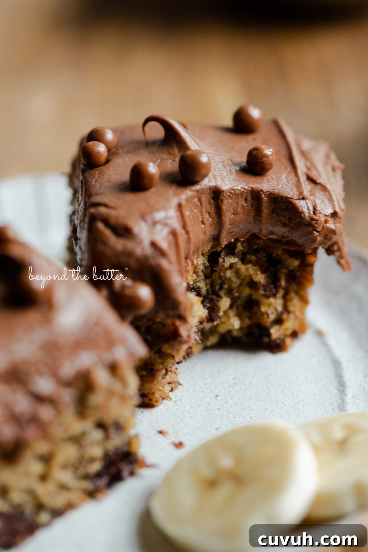 Dessert plate with half eaten slices of banana snack cake
