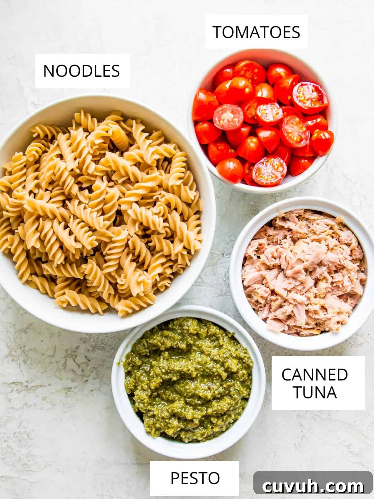 4-Ingredient Tuna Pesto Pasta Recipe – Ready in Minutes 3 The ingredients needed for making tuna pasta pesto in small bowls.