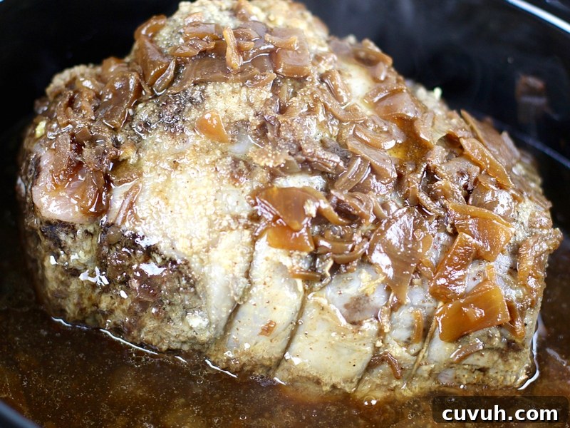 Slow-Cooker French Dip Sandwich Recipe with Juicy Beef and Au Jus 4 Beef just out of the crock pot for French dip sandwiches.