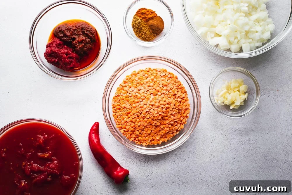 Ingredients for harissa and red lentil soup arranged in glass bowls.
