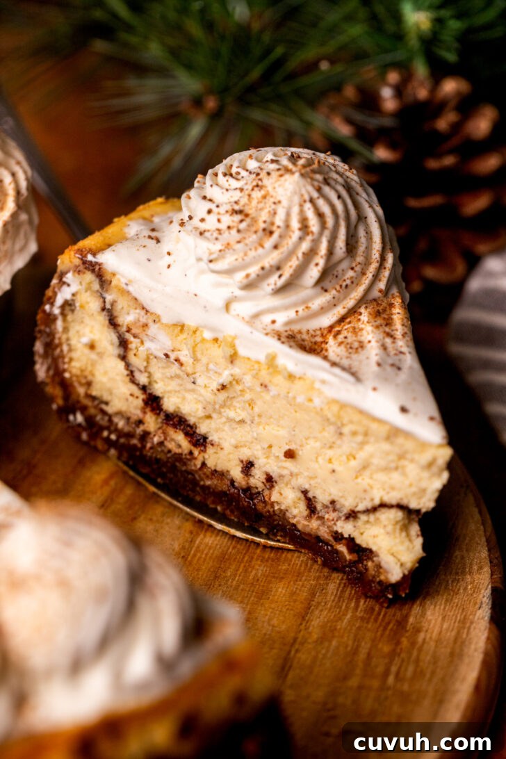 Slice of eggnog cheesecake on a wood platter.