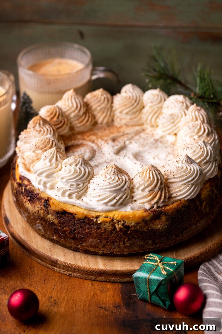 Decorated cheesecake on a wood platter.