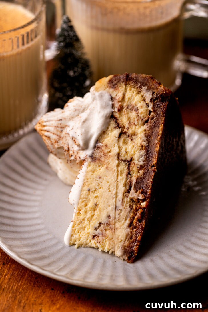 One slice of cheesecake on a plate on its side.