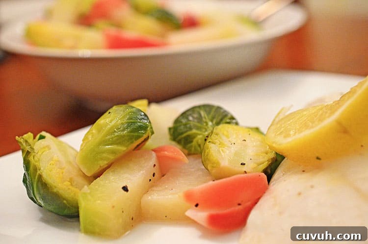 Slow-Braised Vegetables with Garlic and Herbs 6 A plate of food on a table, with Brussels sprouts