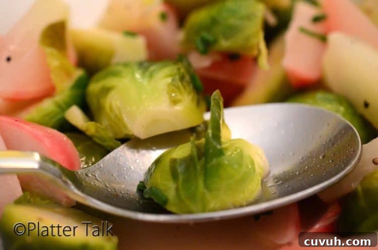 Slow-Braised Vegetables with Garlic and Herbs 7 Tablespoon holding braised vegetables.