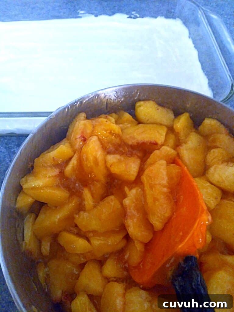 peach filling in a saucepan, and the crumb and cream cheese layer in a 9x13" dish.