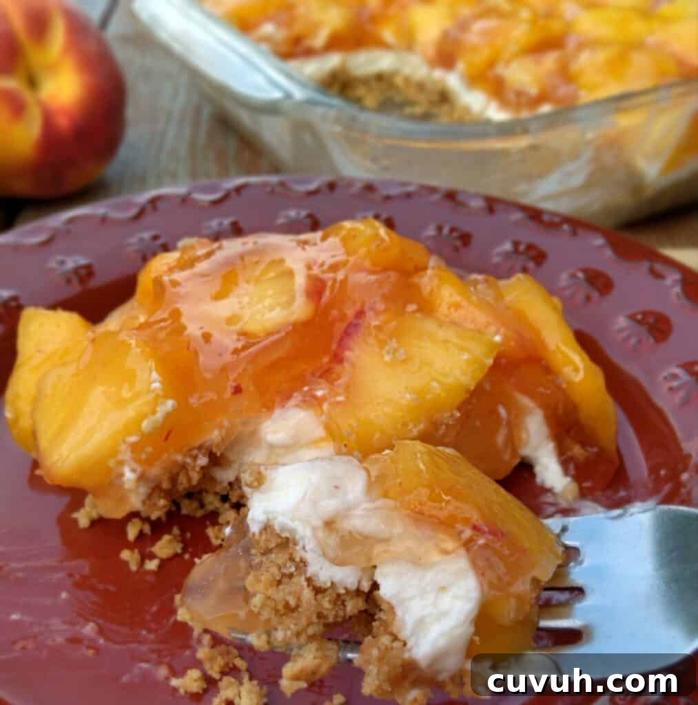layered peach delight on a plate.