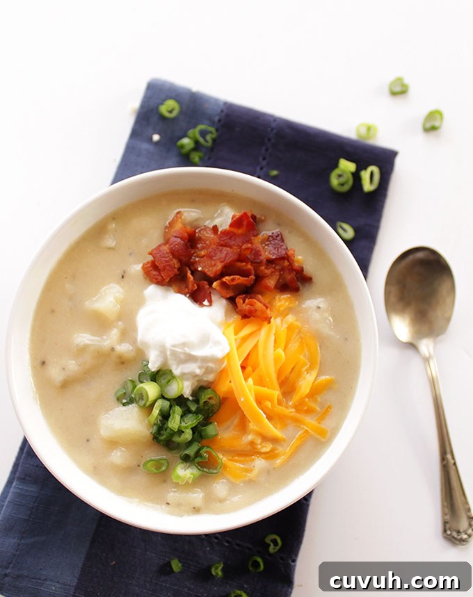 Loaded Baked Potato Soup with Lighter Ingredients 2 Healthier Loaded Baked Potato Soup - Pureed cauliflower instead of heavy cream. So rich and yummy! We LOVE this recipe for wintertime! Gluten Free! | robustrecipes.com