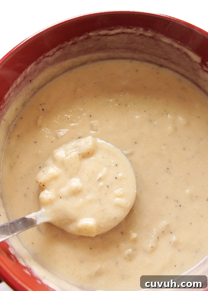 Loaded Baked Potato Soup with Lighter Ingredients 4 Healthier Loaded Baked Potato Soup - Secret ingredient: pureed cauliflower! So creamy! Topped with bacon, souer cream, cheese, and green onions! A gluten free recipe. | robustrecipes.com