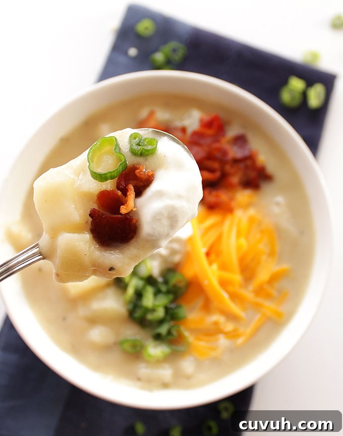 Loaded Baked Potato Soup with Lighter Ingredients 6 Healthier Loaded Baked Potato Soup - The secret ingredient is pureed cauliflower. So rich & creamy. Topped with BACON! Gluten free! | robustrecipes.com