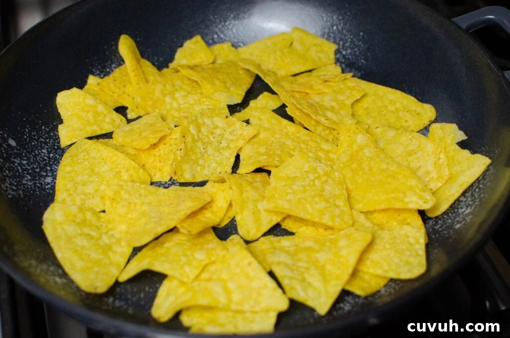 Brunch Nachos: Loaded Breakfast Nachos with Eggs & Avocado 7 Nachos in a cast iron pan