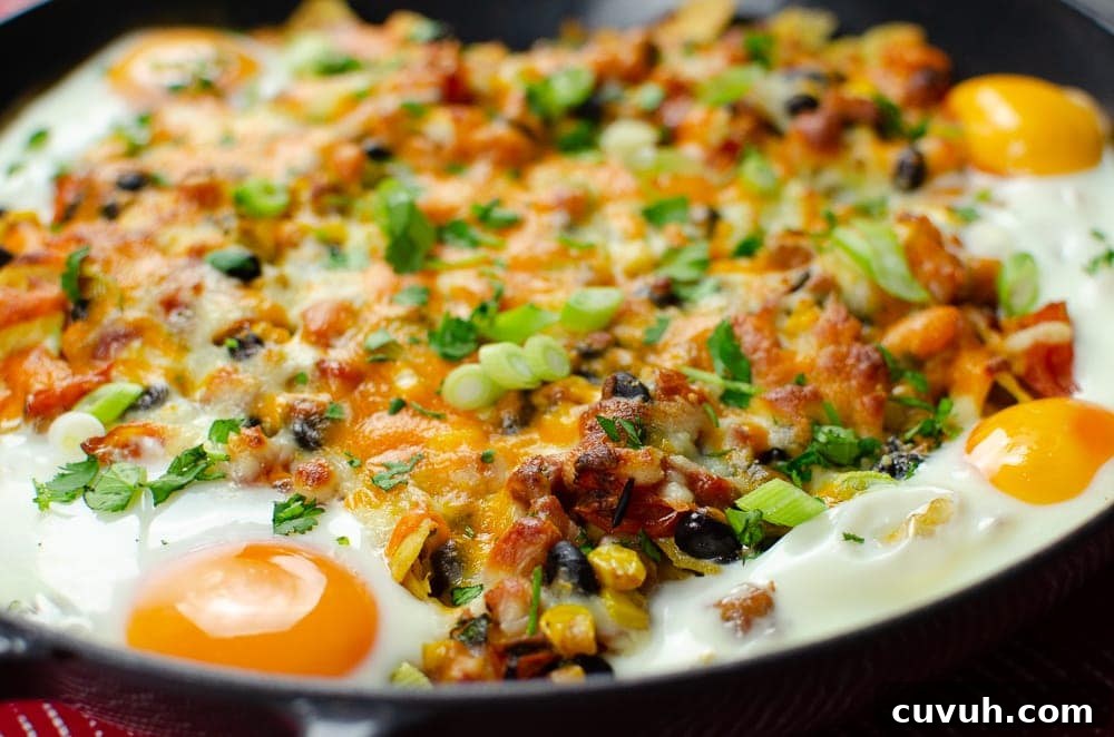 Brunch Nachos: Loaded Breakfast Nachos with Eggs & Avocado 11 Breakfast brunch nachos with four fried eggs on top