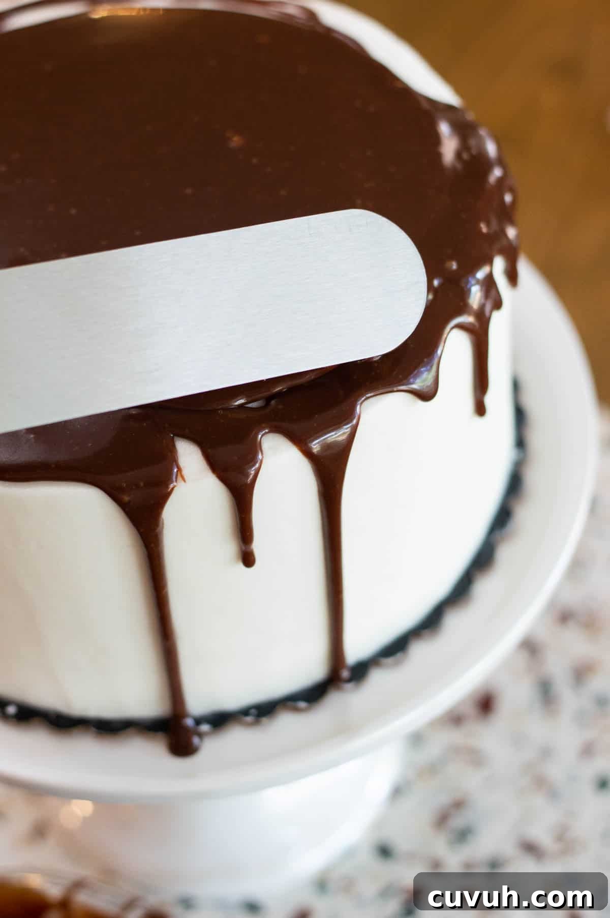 chocolate drip cake using a spatula