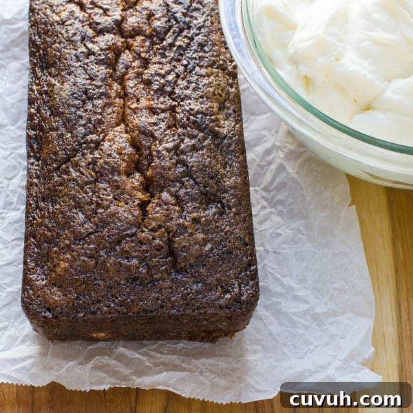 Moist Zucchini Bread Recipe with Brown Sugar and Cinnamon 10 Ultra Moist Zucchini Bread with a bowl of cream cheese frosting.