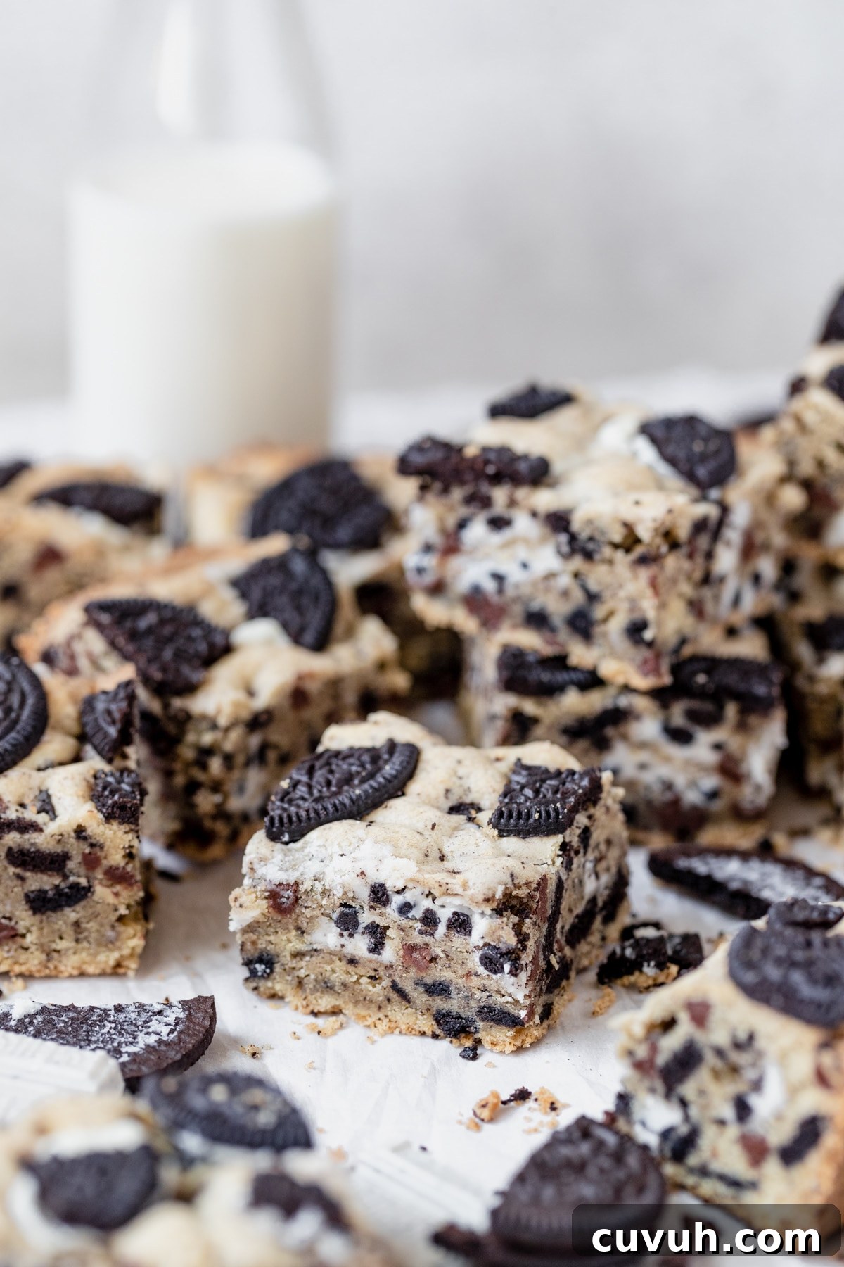 freshly baked cookies and cream bars on parchment paper