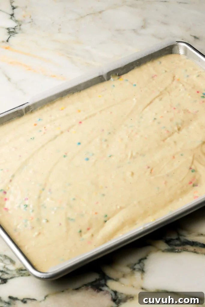 Party-Size Vanilla Birthday Sheet Cake Recipe 11 cake batter spread into prepared pan